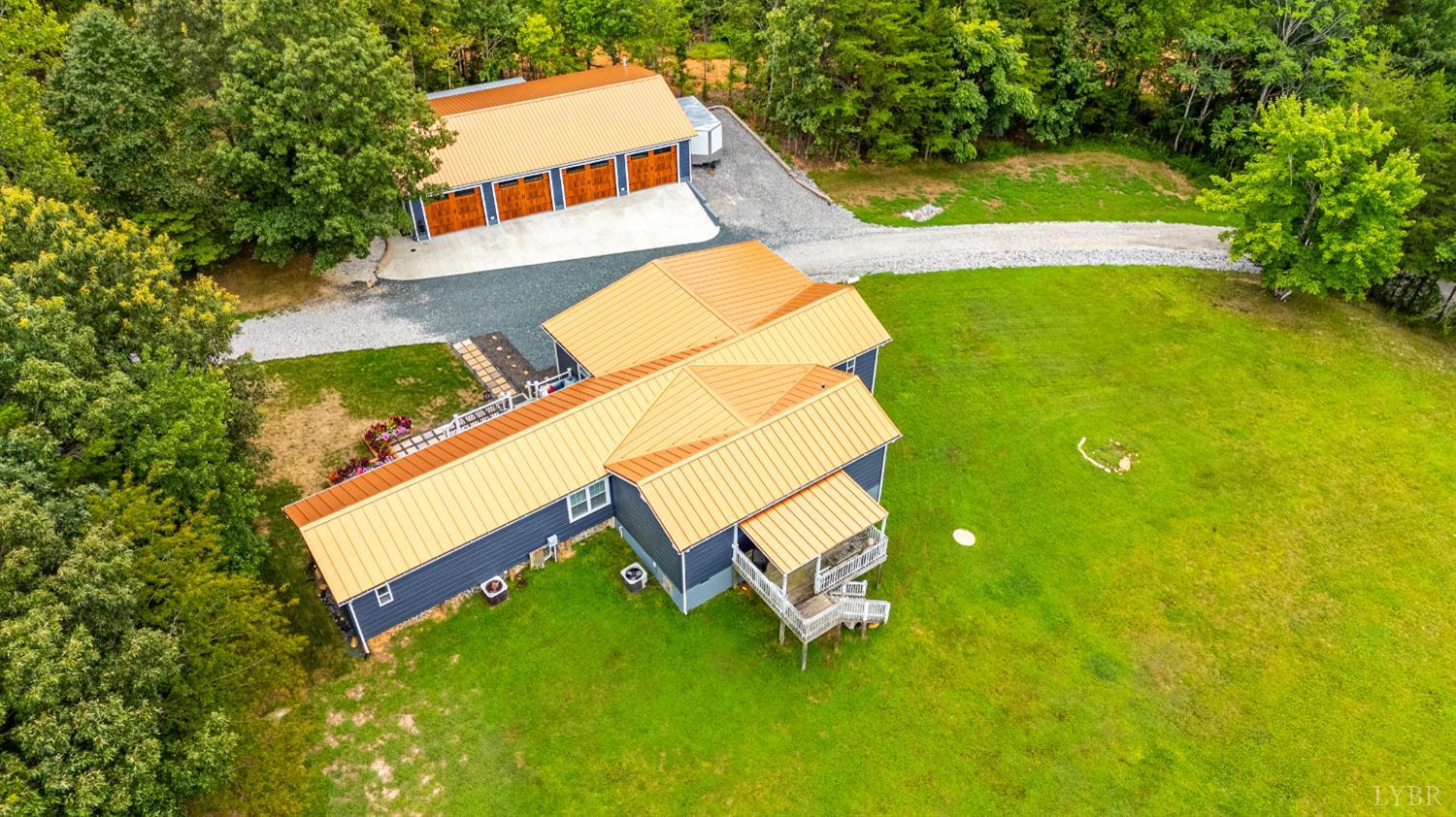 750 Looner Den Road Appomattox, VA 24522 - Photo 2 of 91 an aerial view of a house with swimming pool and tennis court