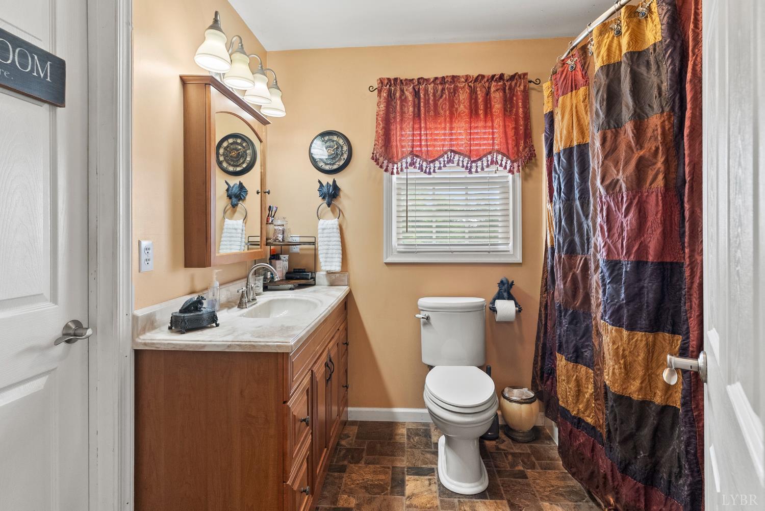 750 Looner Den Road Appomattox, VA 24522 - Photo 29 of 91 a bathroom with a toilet sink and mirror