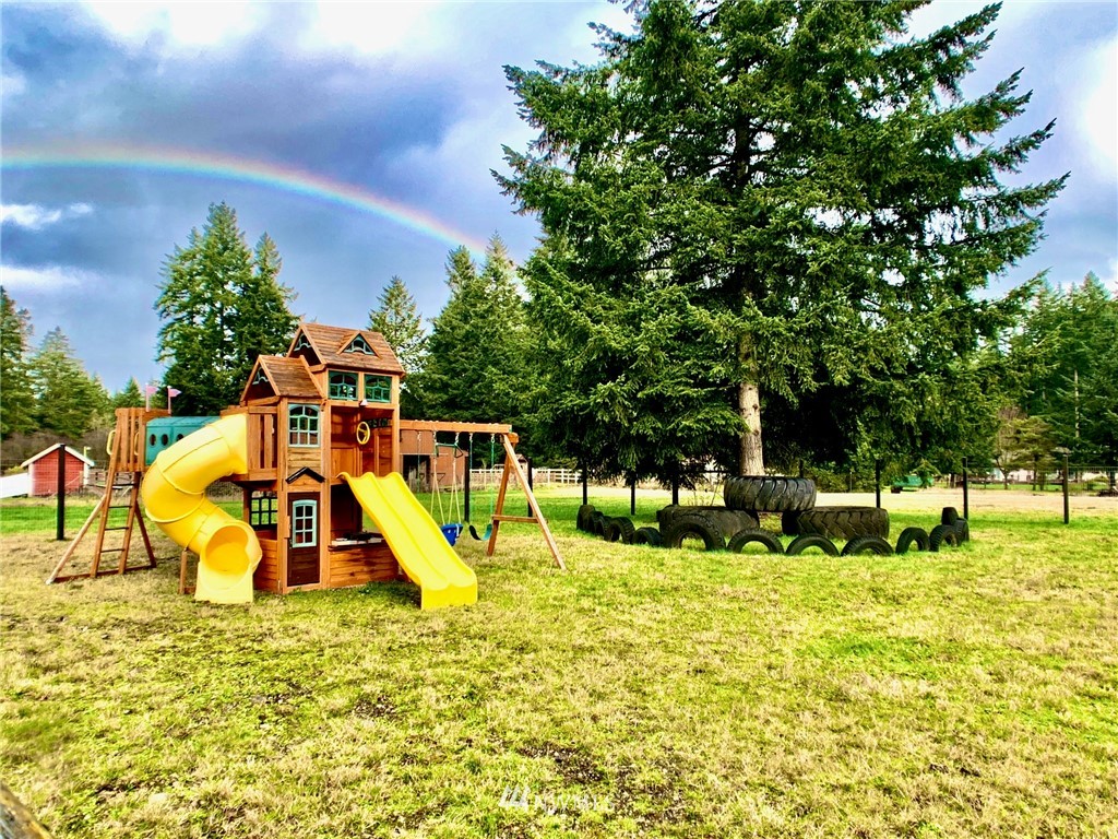 8306 173rd Avenue Southwest Rochester, WA 98579 - Photo 17 of 40 a view of a park with swings and slides
