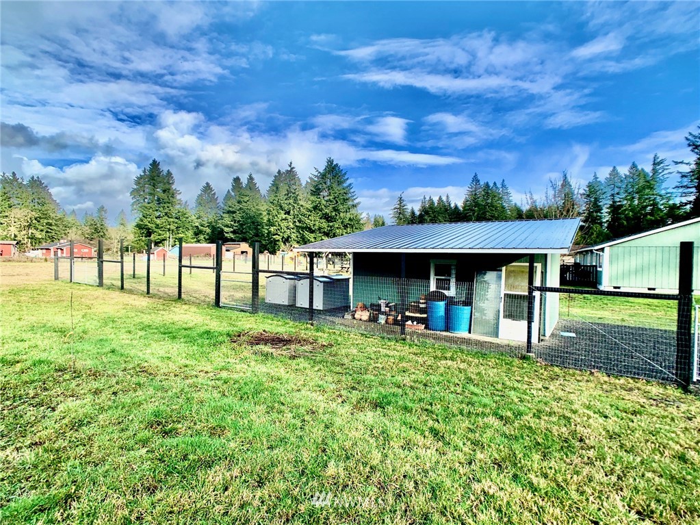 8306 173rd Avenue Southwest Rochester, WA 98579 - Photo 23 of 40 a front view of a house with a yard