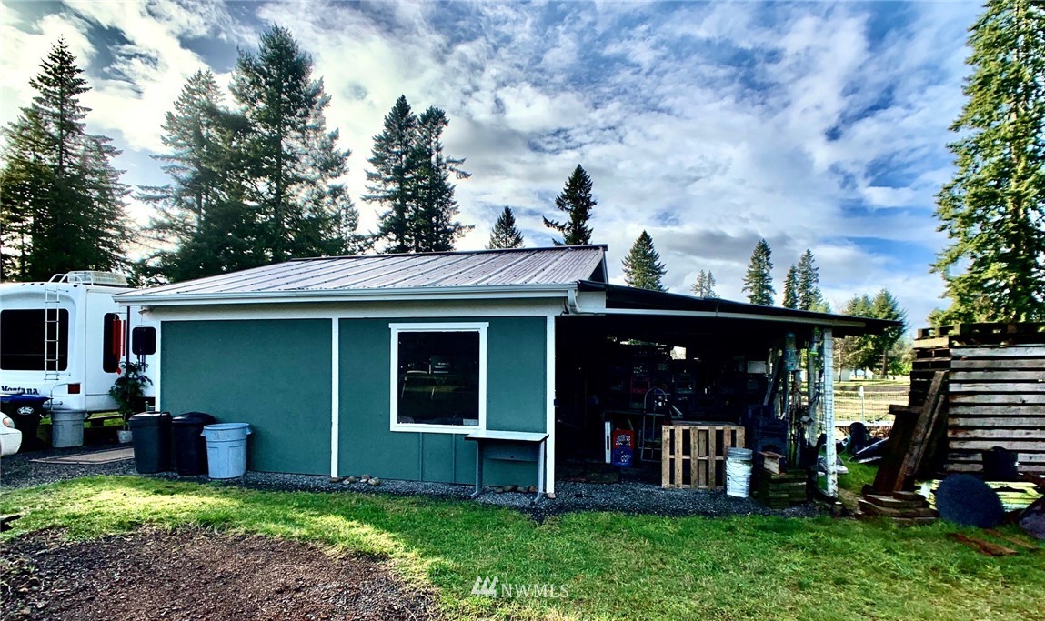 8306 173rd Avenue Southwest Rochester, WA 98579 - Photo 25 of 40 a view of a house with a yard and sitting area