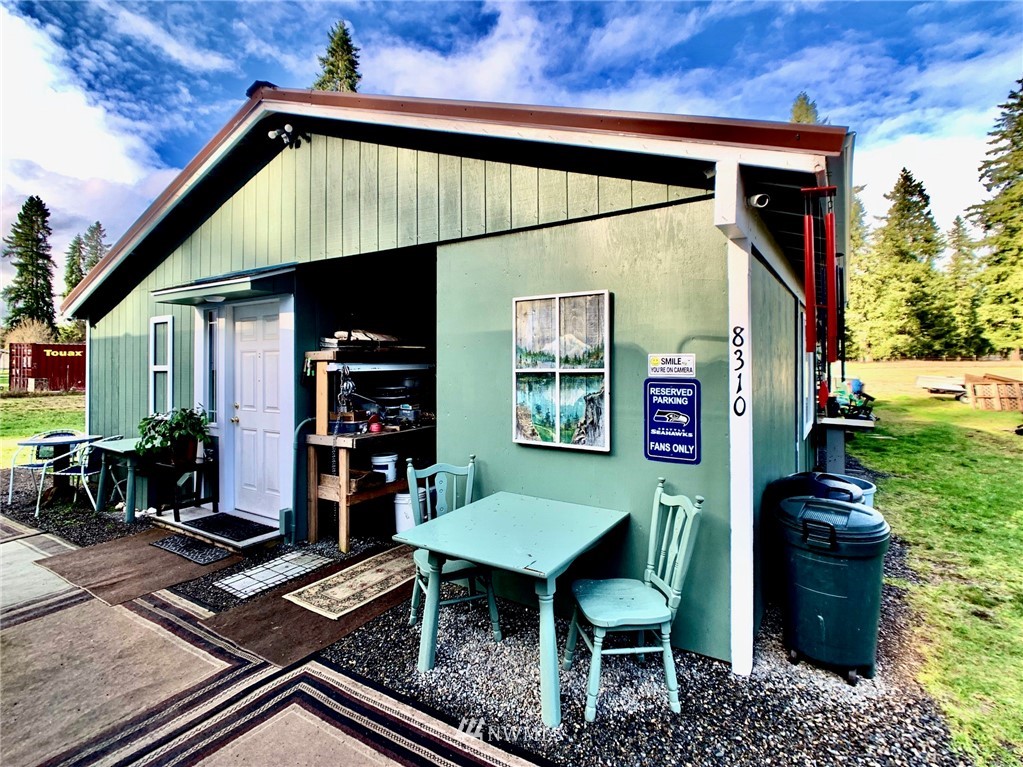8306 173rd Avenue Southwest Rochester, WA 98579 - Photo 26 of 40 a front view of a house with a yard