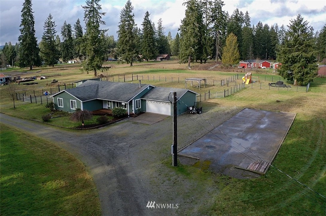8306 173rd Avenue Southwest Rochester, WA 98579 - Photo 32 of 40 a view of a swimming pool with a yard