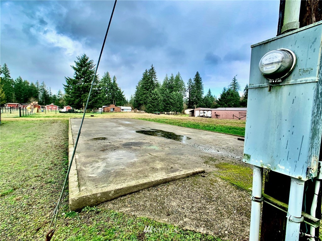 8306 173rd Avenue Southwest Rochester, WA 98579 - Photo 33 of 40 a view of a backyard with large trees
