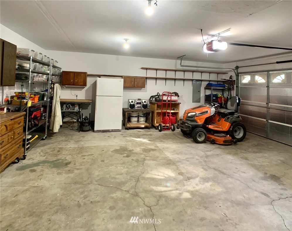 8306 173rd Avenue Southwest Rochester, WA 98579 - Photo 35 of 40 a view of a garage with parked cars