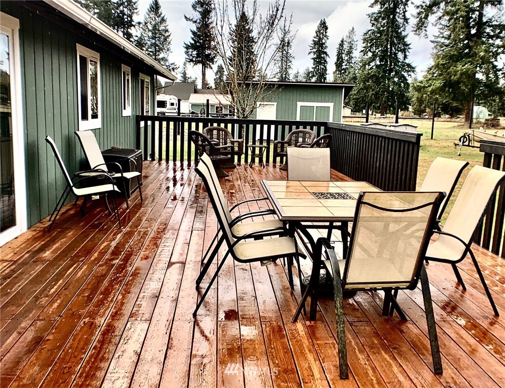 8306 173rd Avenue Southwest Rochester, WA 98579 - Photo 36 of 40 a view of a chairs and table on the deck