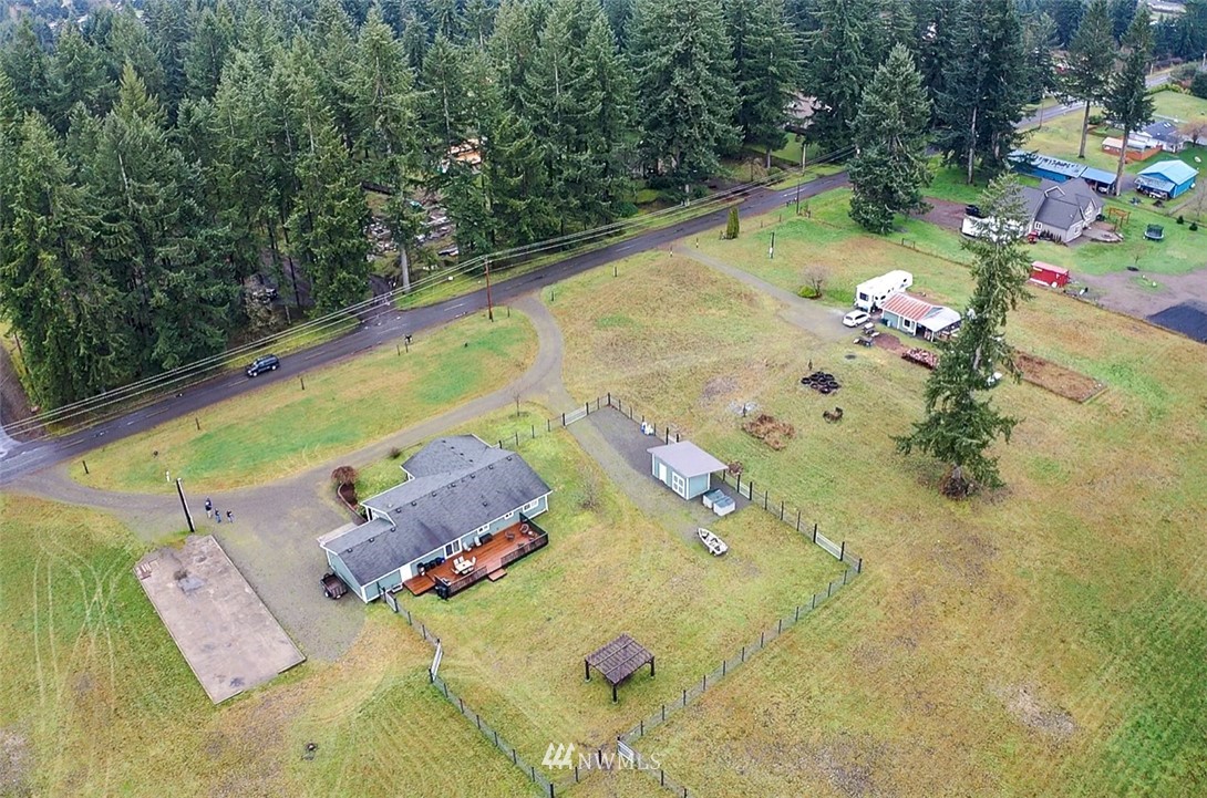 8306 173rd Avenue Southwest Rochester, WA 98579 - Photo 38 of 40 an aerial view of residential houses with outdoor space
