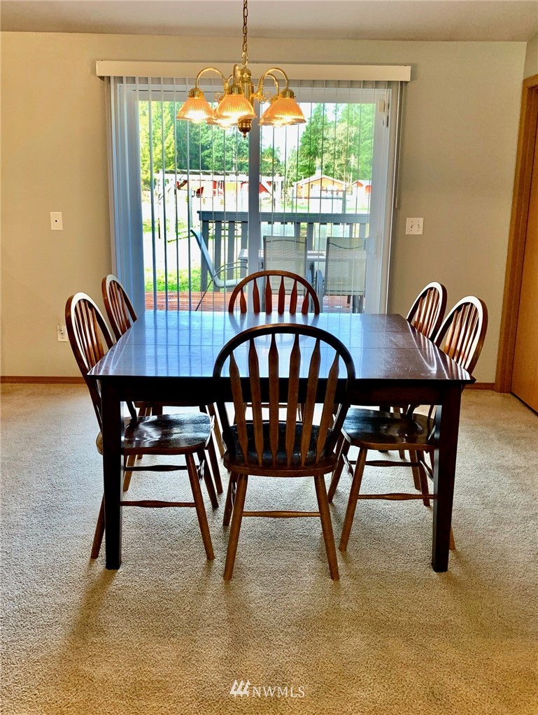 8306 173rd Avenue Southwest Rochester, WA 98579 - Photo 6 of 40 a view of a dining room with furniture window and outside view
