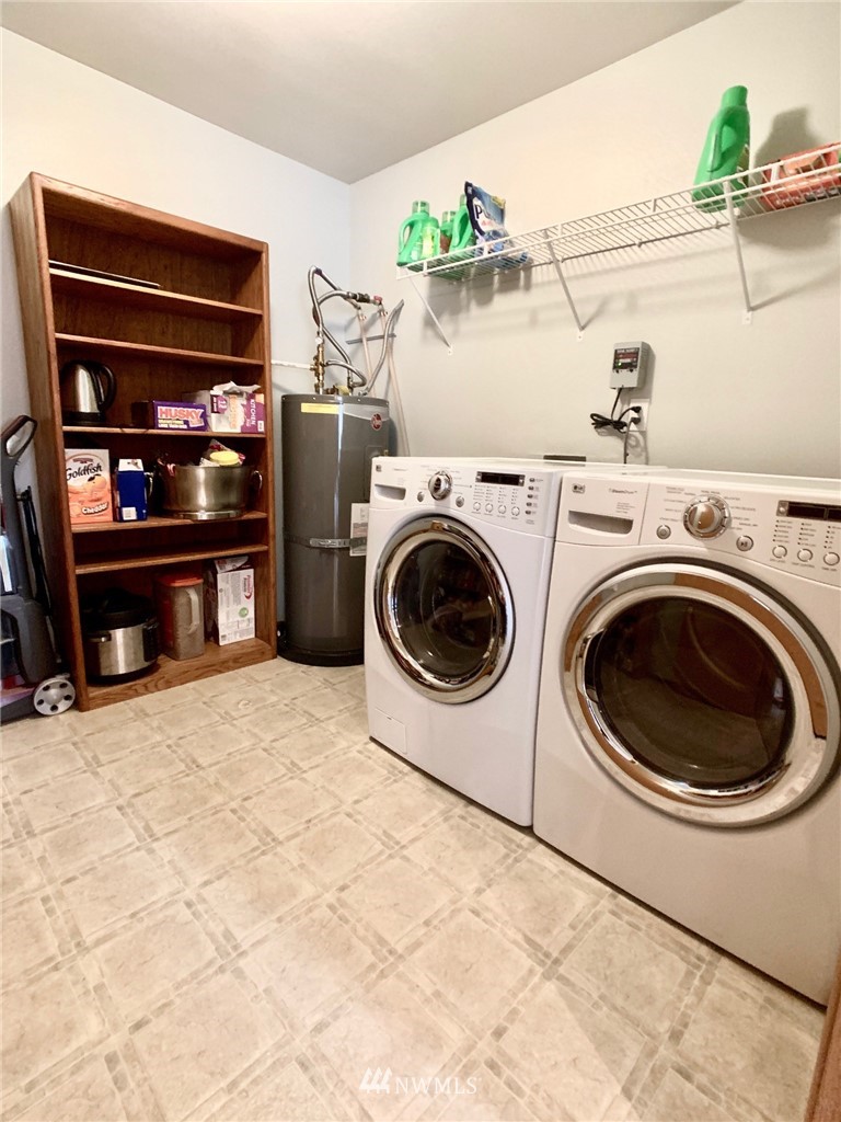8306 173rd Avenue Southwest Rochester, WA 98579 - Photo 8 of 40 a utility room with dryer and washer