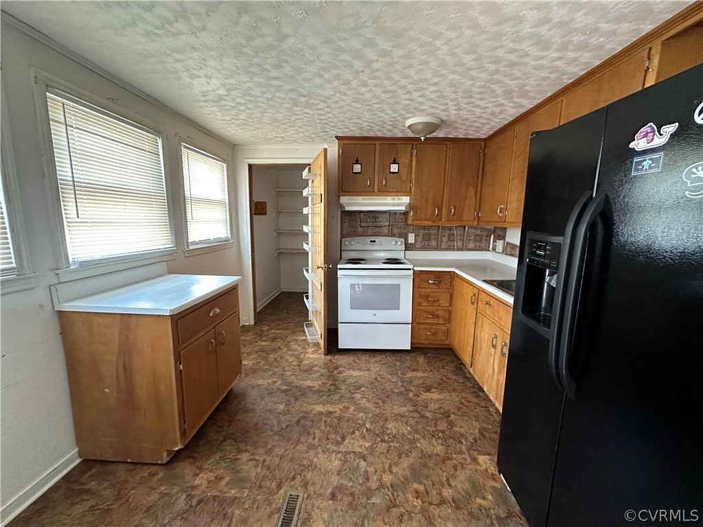 2007 West City Point Road Hopewell, VA 23860 - Photo 2 of 9 a kitchen with cabinets and stainless steel appliances