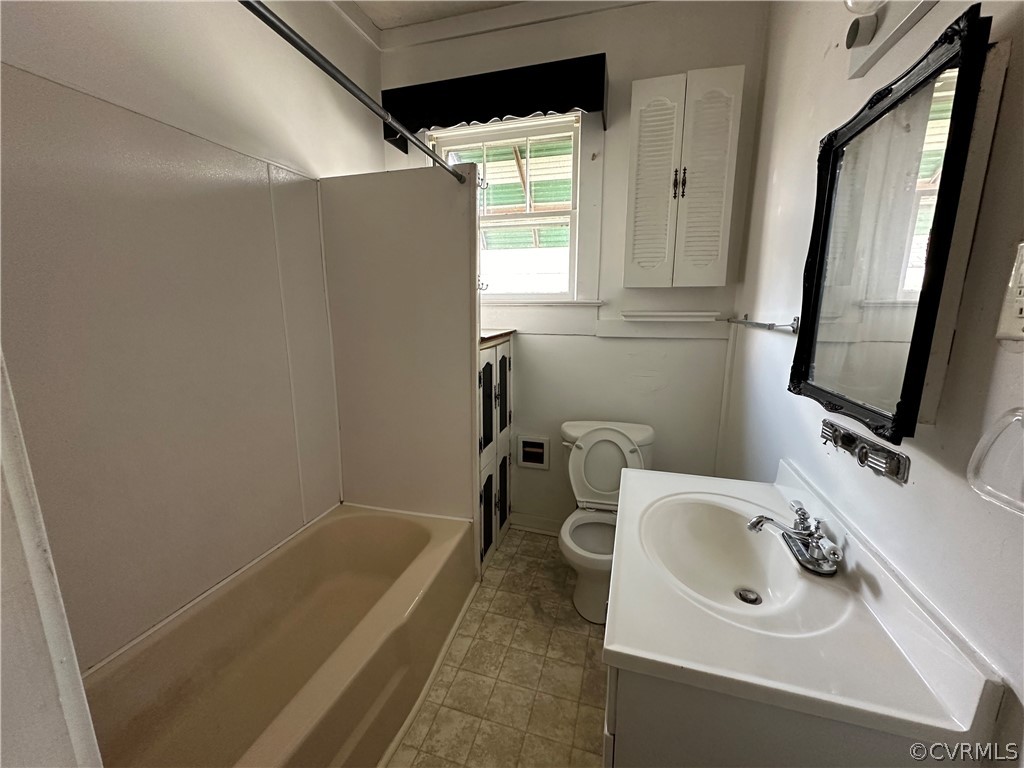 2007 West City Point Road Hopewell, VA 23860 - Photo 5 of 9 a bathroom with a sink a bathtub and a window