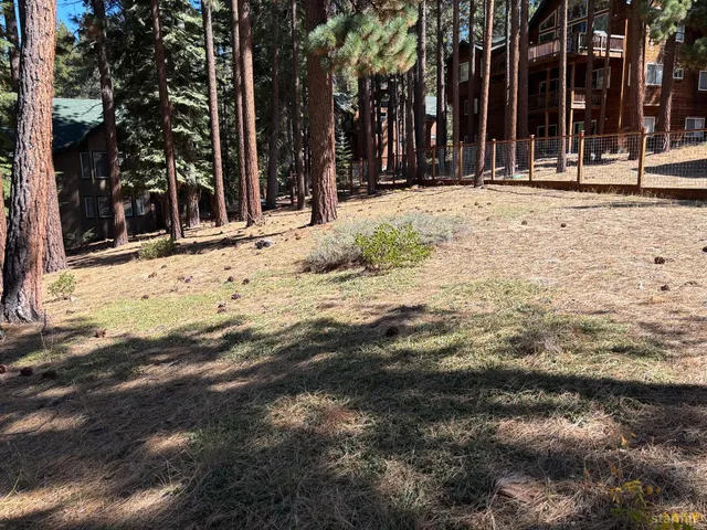 a view of a house with snow on the road