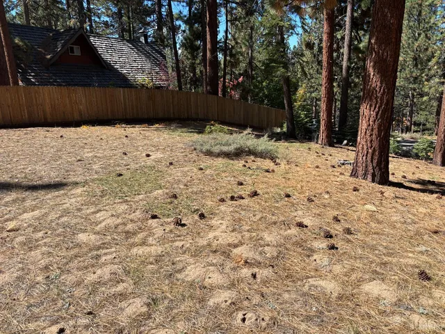 a wooden fence covered with snow