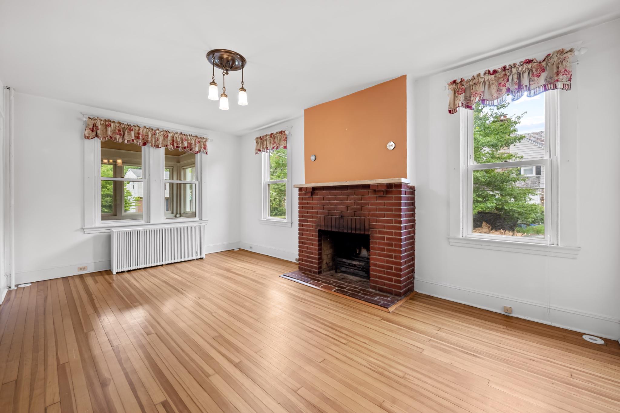 600 Dunkirk Road Baltimore, MD 21212 - Photo 8 of 36 Large living room with wood-burning fireplace.