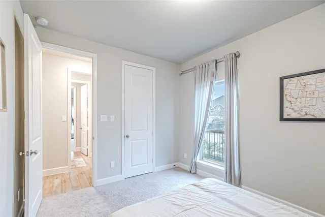 a view of a room with wooden floor and stairs