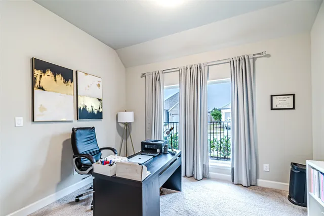 a workspace with furniture and window