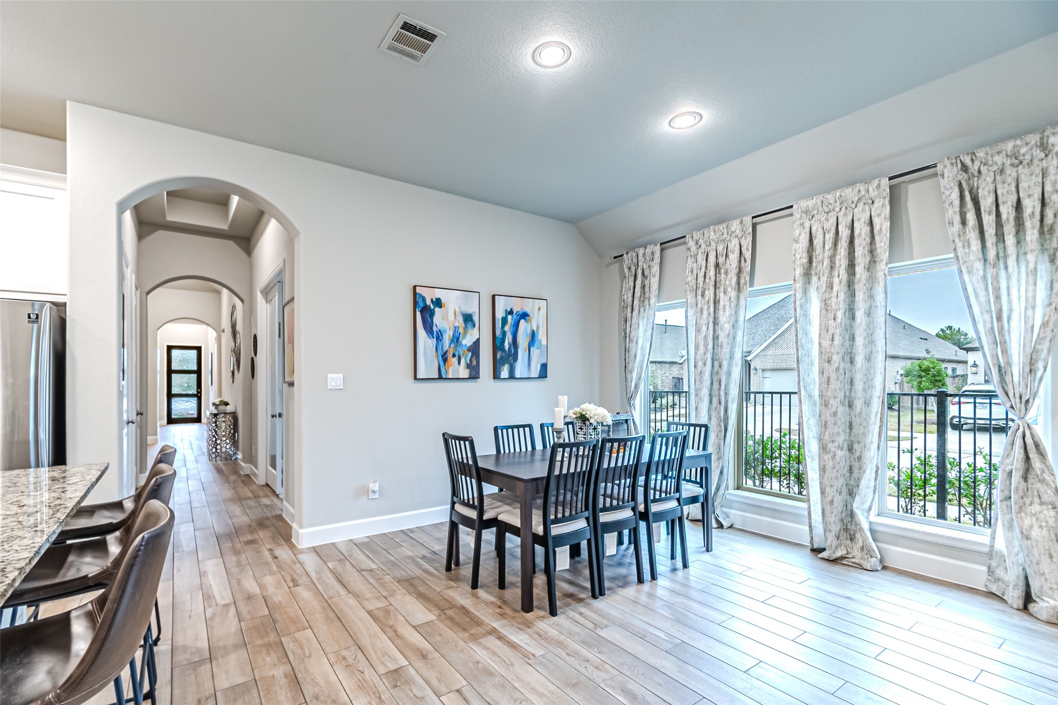 15022 Concho River Way Cypress, TX 77433 - Photo 28 of 50 a view of a dining room with furniture window and wooden floor