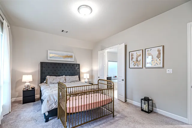 a bedroom with furniture and a window
