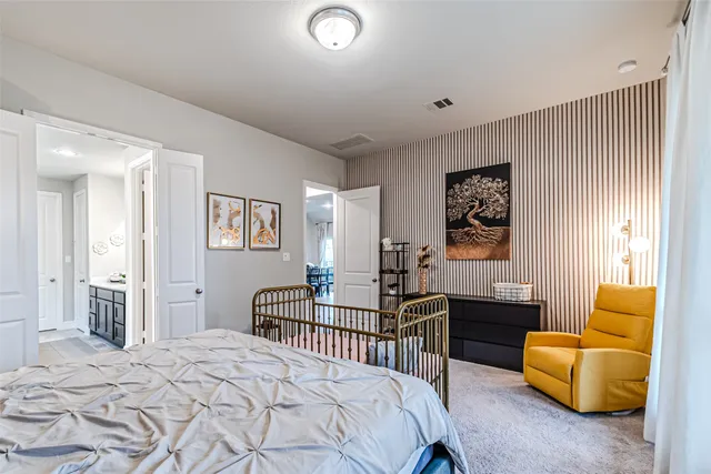 a bedroom with furniture and a window