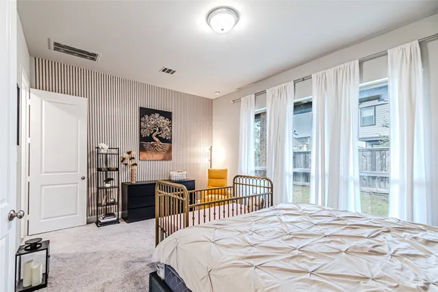 a bathroom with a double vanity sink toilet mirror and bathtub