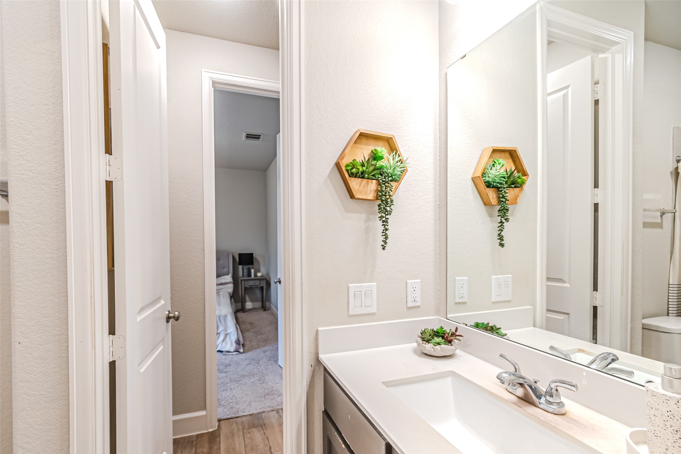 15022 Concho River Way Cypress, TX 77433 - Photo 10 of 50 a bathroom with a granite countertop sink and a mirror