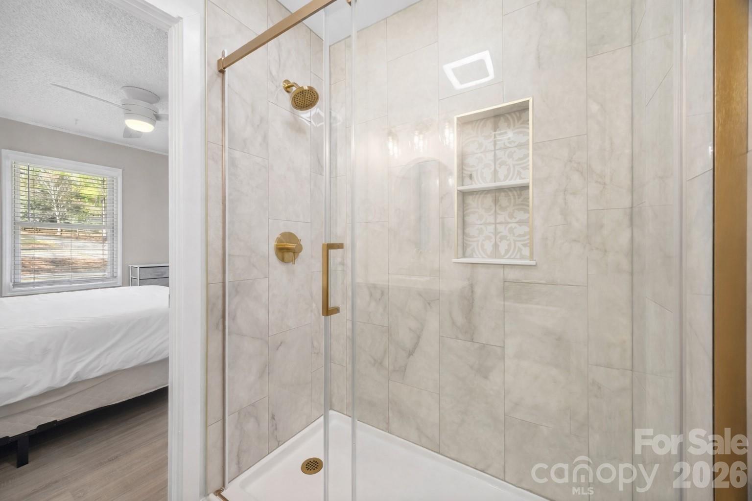 5280 Masons Ferry Road Clover, SC 29710 - Photo 19 of 45 a bathroom with a bathtub and a shower