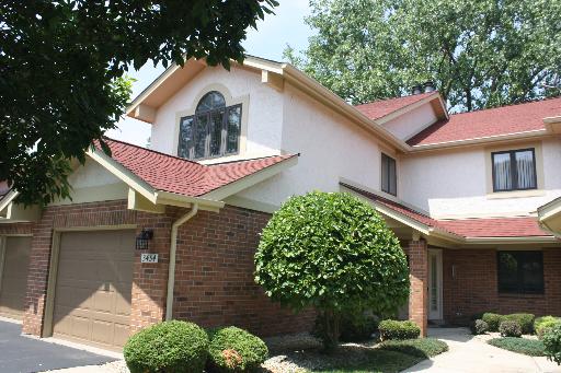 3452 Beckwith Lane, Unit 3452 Crete, IL 60417 - Photo 1 of 1 a front view of a house with garden