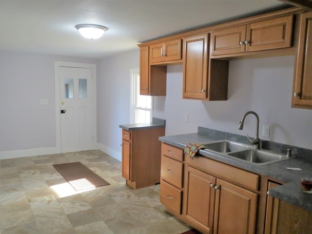 31019 Genesee Road Sterling, IL 61081 - Photo 5 of 32 a kitchen that has a sink and cabinets