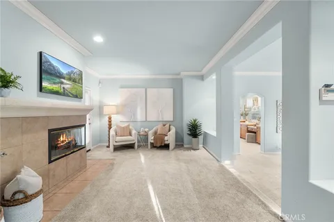 a bedroom with furniture and a potted plant