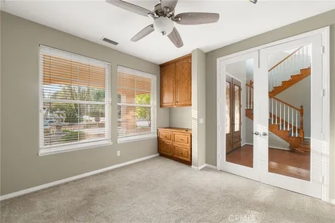 a bedroom with a bed and a potted plant
