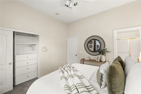 a view of a kitchen with white cabinets