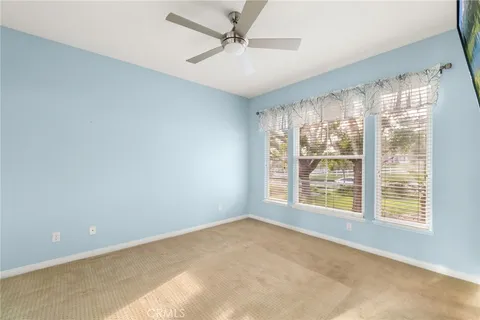 a bathroom with a sink a toilet a mirror and shower