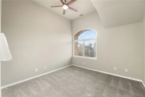 a open dining room with stainless steel appliances granite countertop a stove top oven a dining table and chairs with wooden floor