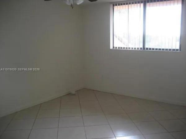 a view of an empty room and window
