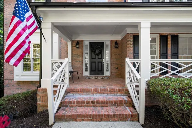 a front view of a house with large windows