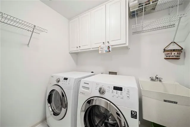 a bathroom with a granite countertop sink a toilet a mirror and bathtub