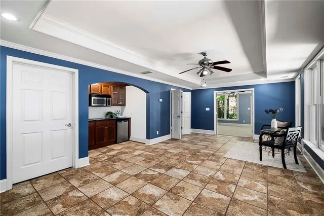 a front view of house with a garden