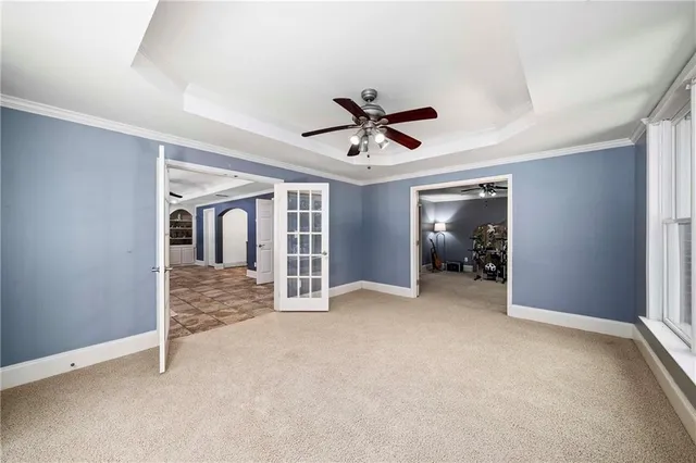 an aerial view of residential house with outdoor space and trees all around
