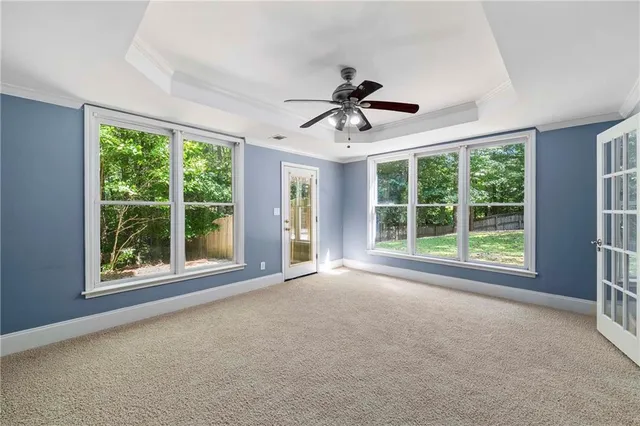 a front view of a house with a garden and plants
