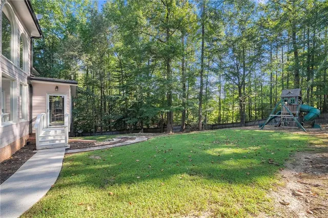 a view of a swimming pool with an outdoor seating