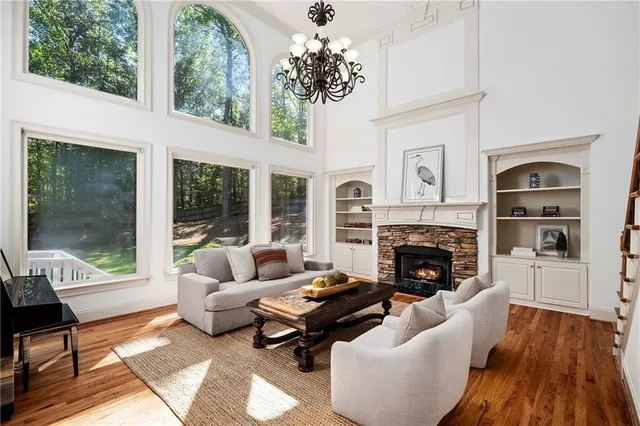 a living room with furniture fireplace and flat screen tv