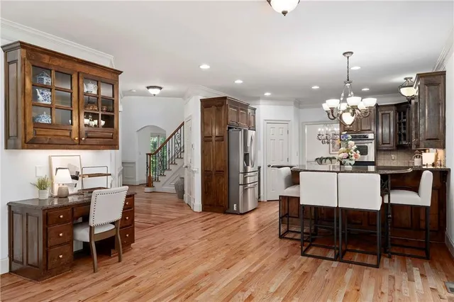 a dining room with furniture and wooden floor