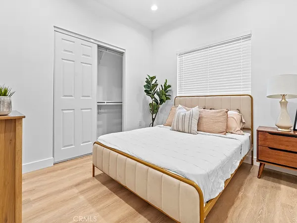 a bedroom with a bed and a table