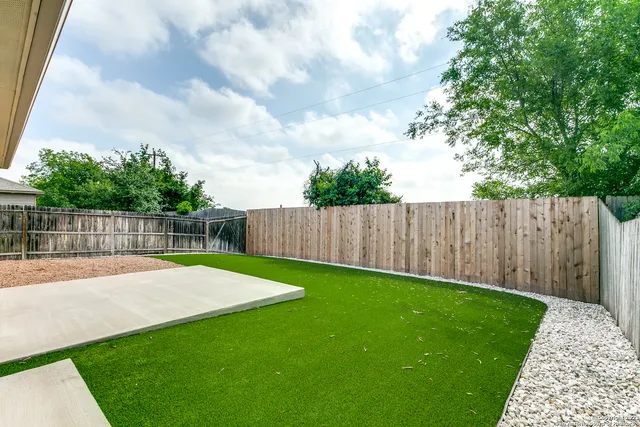 a view of a backyard with a small cabin