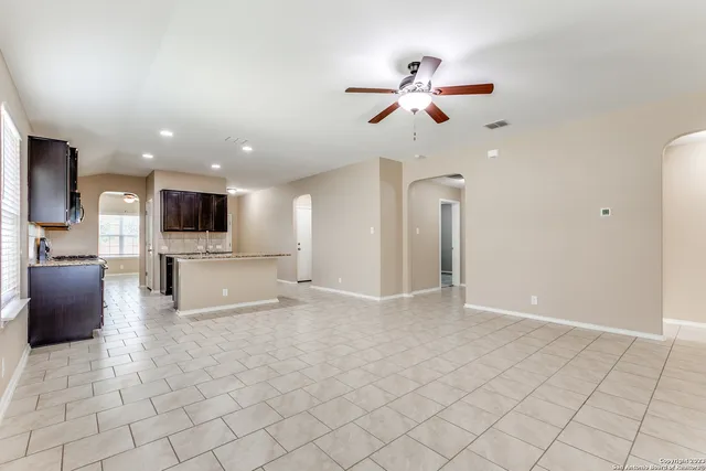 a view of a kitchen with furniture and a chandelier