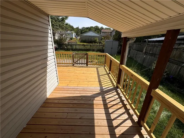 a view of balcony with wooden floor