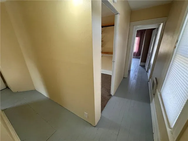 a view of a hallway with a glass door