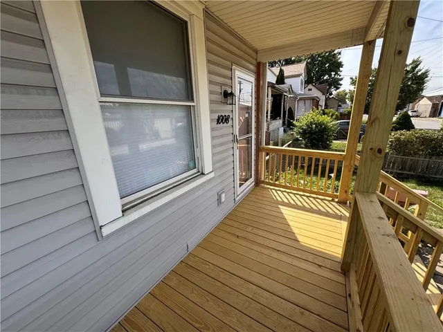 a balcony with hardwood