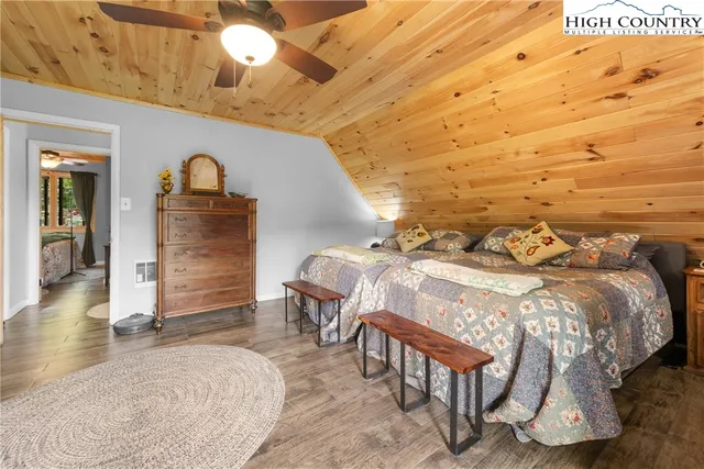 a bedroom with a bed and a table