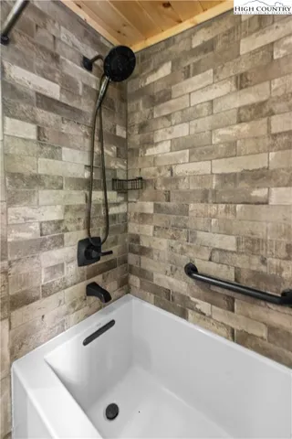 a bathroom with a sink and a granite countertop
